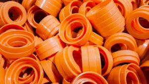 circular, orange custom molded parts